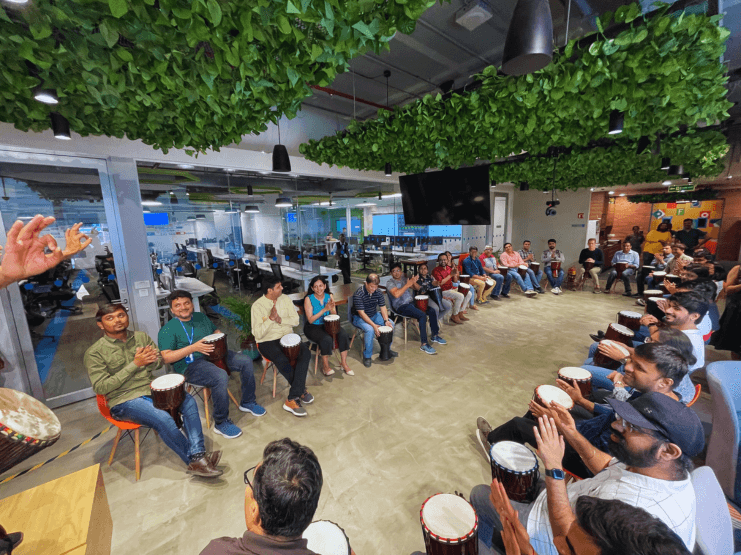 2.2_Check out some of our In-Office Employee Engagement Experiences_ Priceline_Apr22_Drum Circle_9